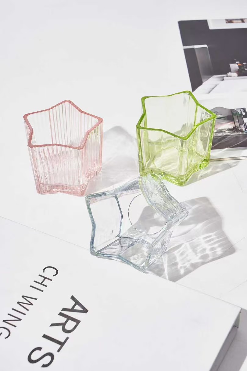 Suport de lumânări din sticlă în formă de stele